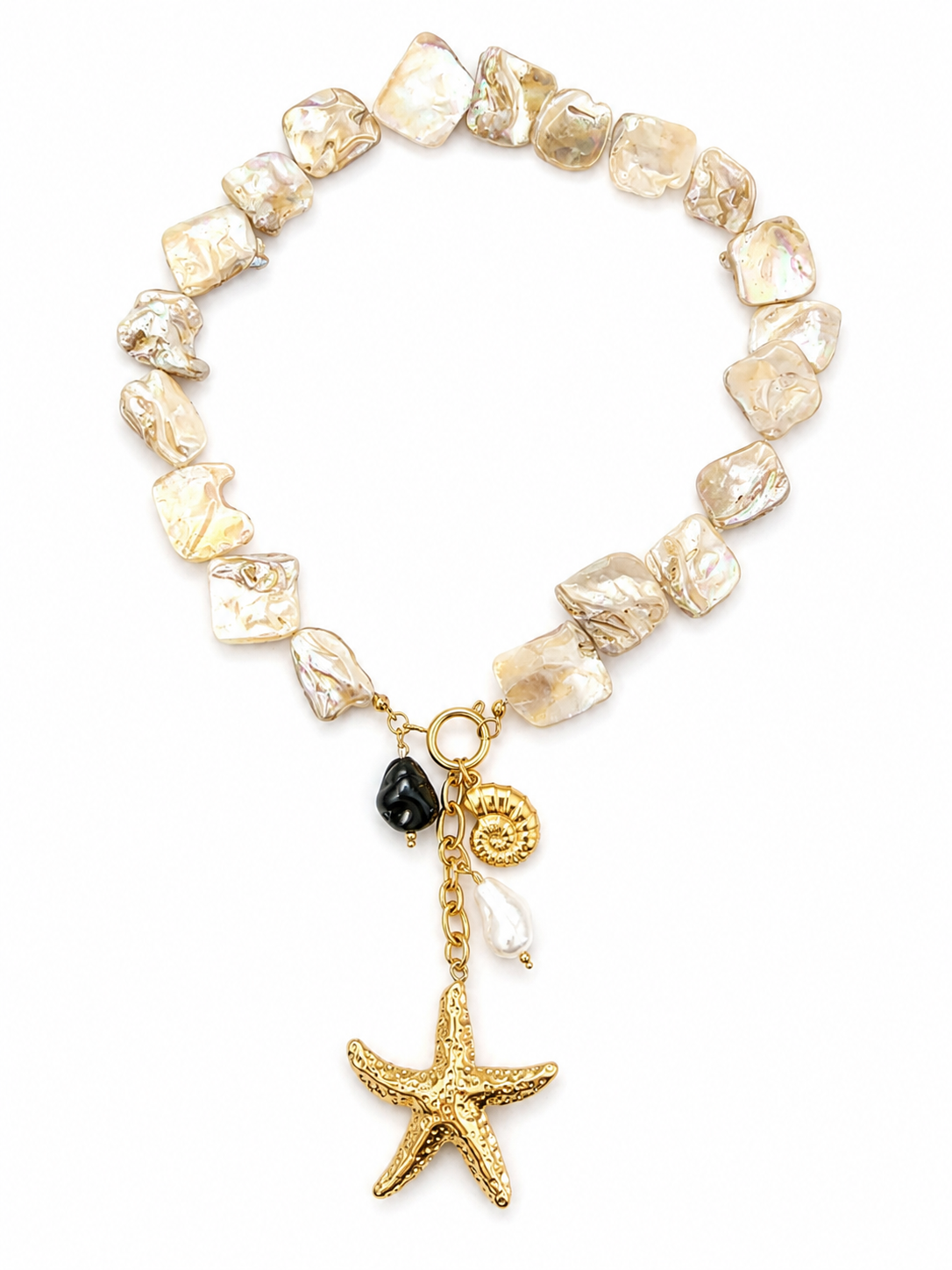 Gold stainless steel necklace with natural freshwater pearls, front clasp and sea-inspired charms including starfish, shell and ammonite.