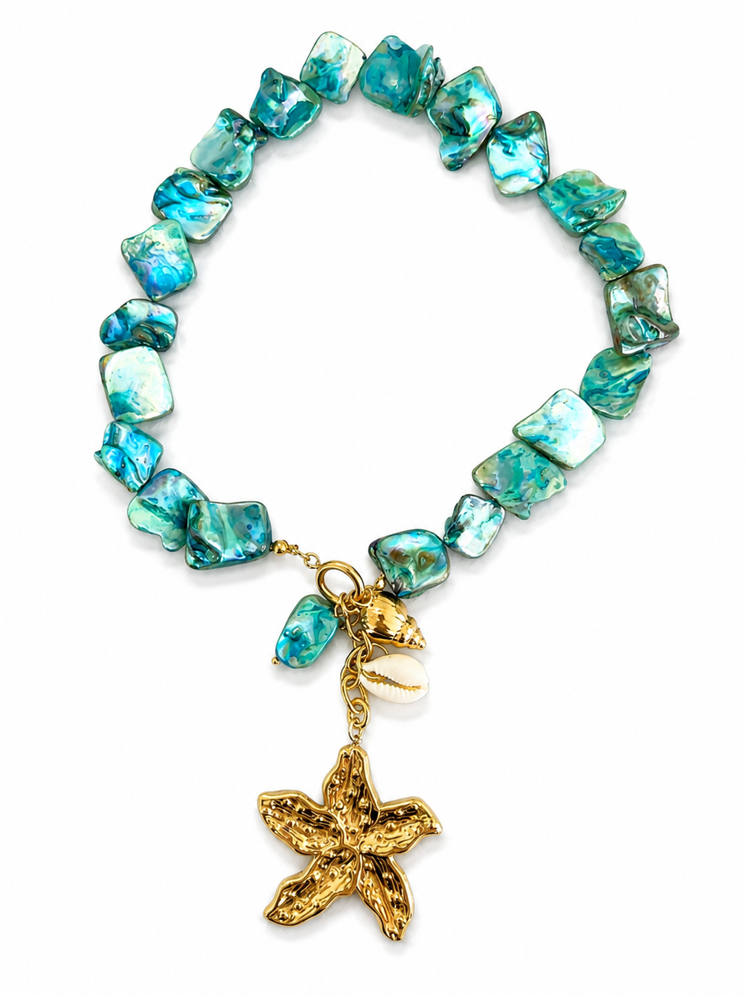 So Cute by Dimi Nausicaa Necklace featuring turquoise mother of pearl beads, a gold flower charm, shell charm and stainless steel front clasp.
