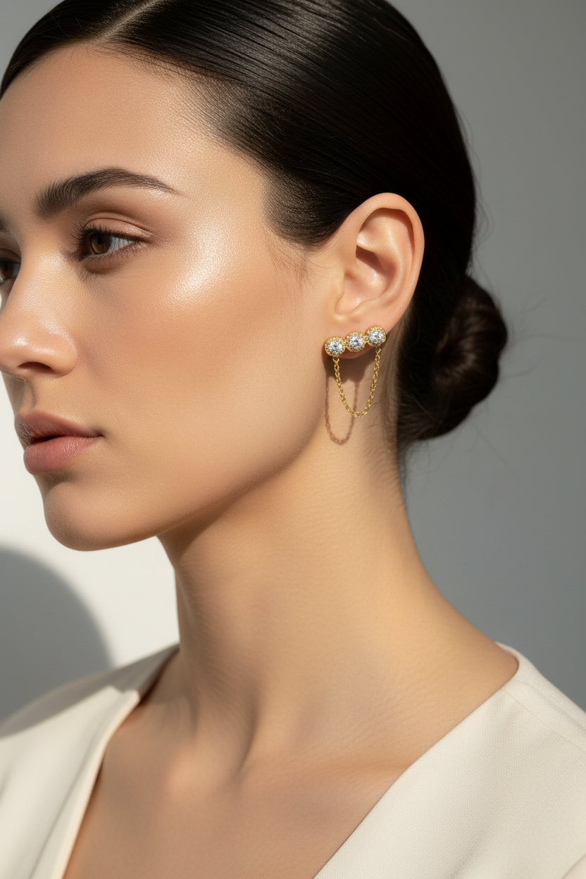 Trinity Chain Earrings ατσάλινα σκουλαρίκια με ζιργκόν και αλυσίδα σε χρυσό – So Cute by Dimi