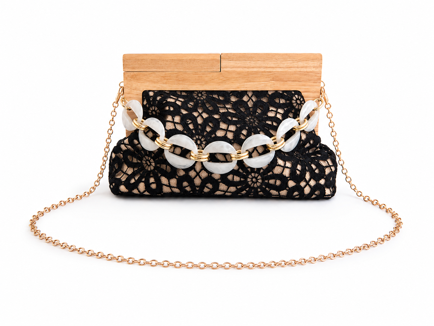Black lace handbag with wooden top and gold chain strap on a white background