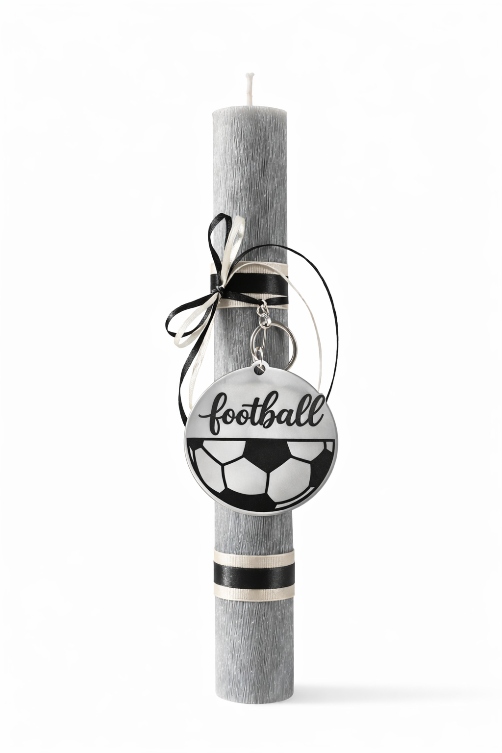 Decorative easter candle with a 'football' charm on a white background