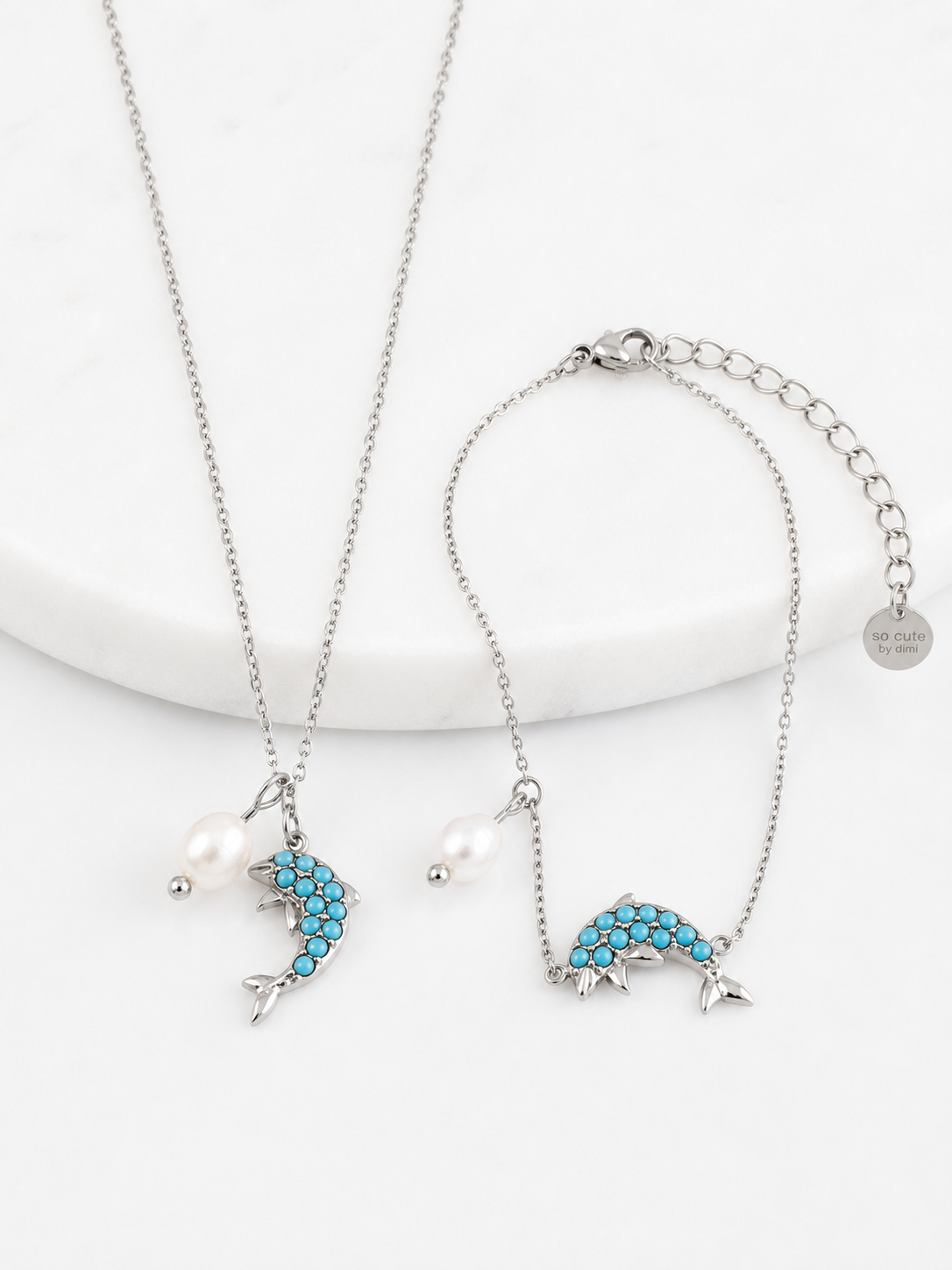 Azure Dolphin Bracelet ατσάλινο βραχιόλι σε χρυσό ή ασημί με δελφίνι από τιρκουάζ ζιργκόν και φυσική πέρλα – So Cute by Dimi