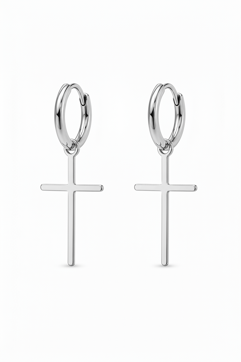 Silver hoop earrings with cross pendants on a white background