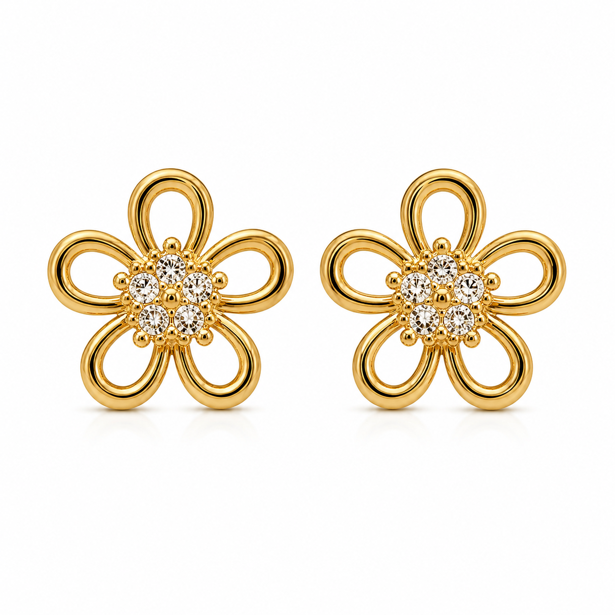 Gold flower-shaped earrings with diamond centers on a white background
