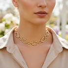 Ατσάλινο choker κολιέ με οβάλ κρίκους μικρού και μεγάλου μεγέθους σε χρυσό, So Cute by Dimi
