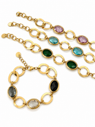 Elodie Bracelet χρυσά ατσάλινα βραχιόλια με οβάλ κρυστάλλινες πέτρες και μεγάλους κρίκους, σε λευκό φόντο