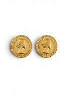 Pair of gold coin-shaped earrings on a white background