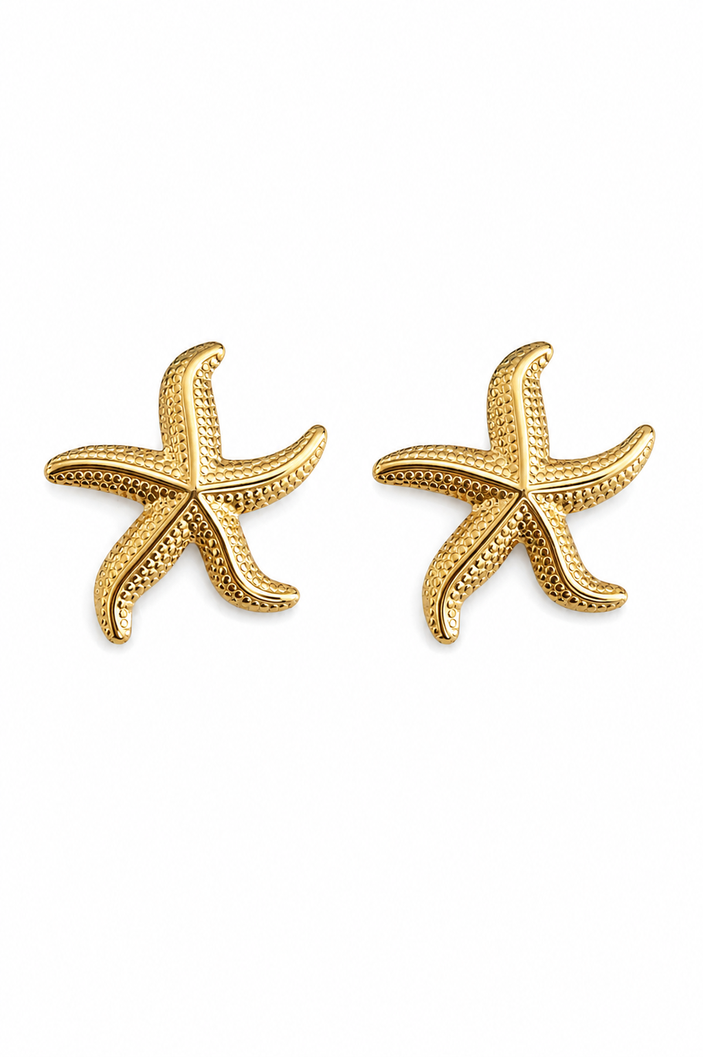 A pair of gold starfish stud earrings on a plain white background.