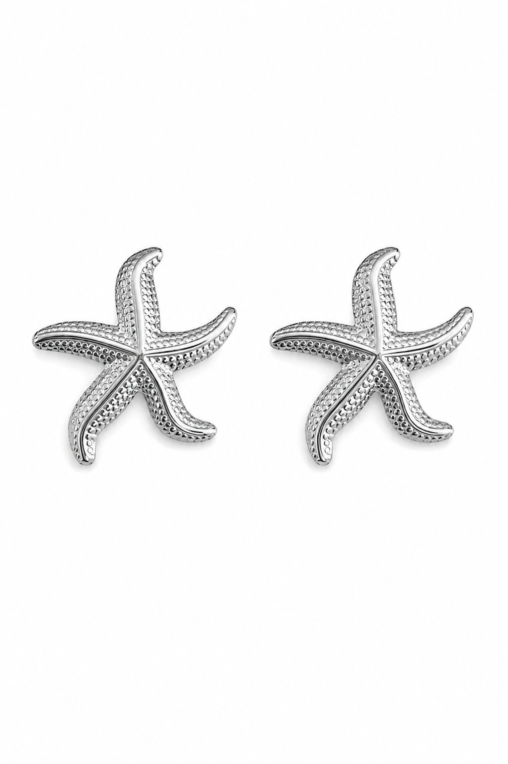 A pair of silver starfish stud earrings with a textured, beaded outer edge and smooth center, displayed on a clean white background.