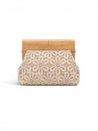 Clutch bag with lace design and wooden frame on a white background