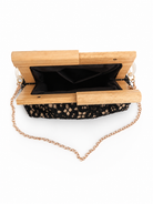 Clutch bag with wooden top and chain strap on a white background, ανοιχτή