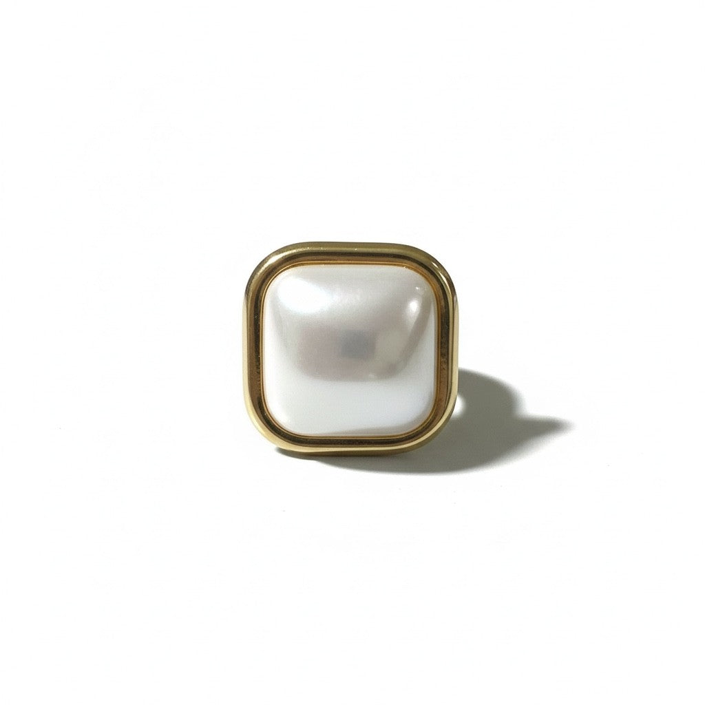 Gold-framed square mirror on a white background