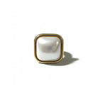 Gold-framed square mirror on a white background