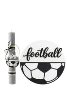 Decorative items with 'football' theme including a candle, ornament, and plate on a white background.
