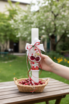 Χειροποίητη πασχαλινή λαμπάδα με cherry print σατέν ύφασμα, σατέν φιόγκους, πράσινο κρύσταλλο και μπρελόκ κεράσι από πλεξιγκλάς. So Cute by Dimi