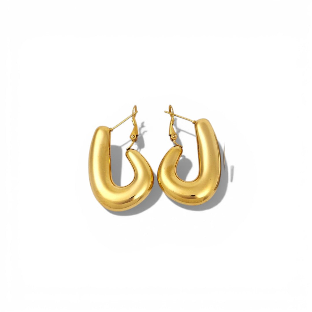 Gold hoop earrings on a white background