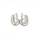 Silver hoop earrings on a white background