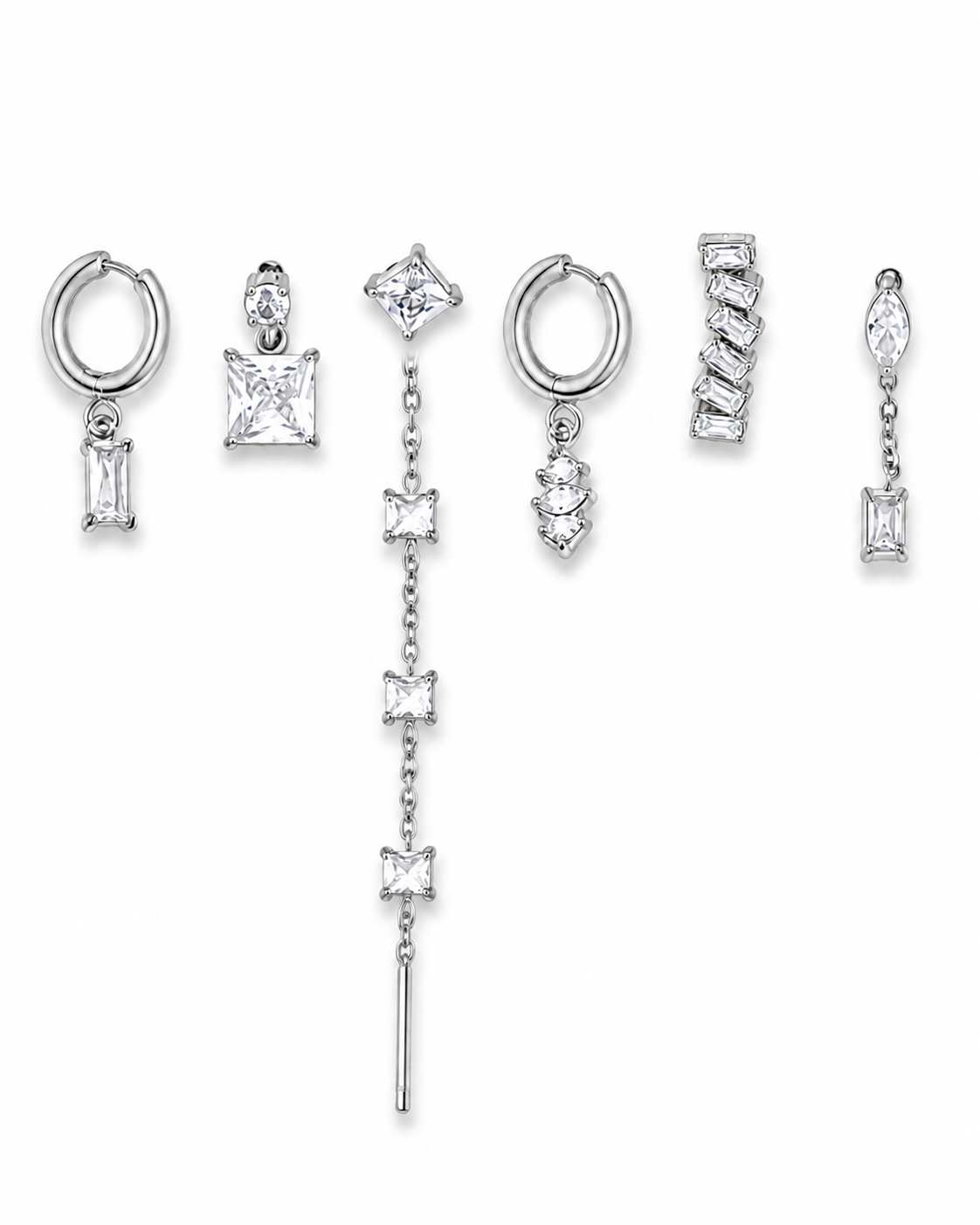Set of silver earrings with various designs on a white background
