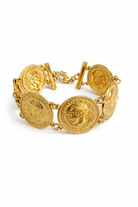 Gold coin bracelet on a white background
