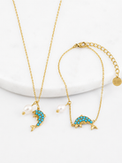 Azure Dolphin Bracelet ατσάλινο βραχιόλι σε χρυσό ή ασημί με δελφίνι από τιρκουάζ ζιργκόν και φυσική πέρλα – So Cute by Dimi