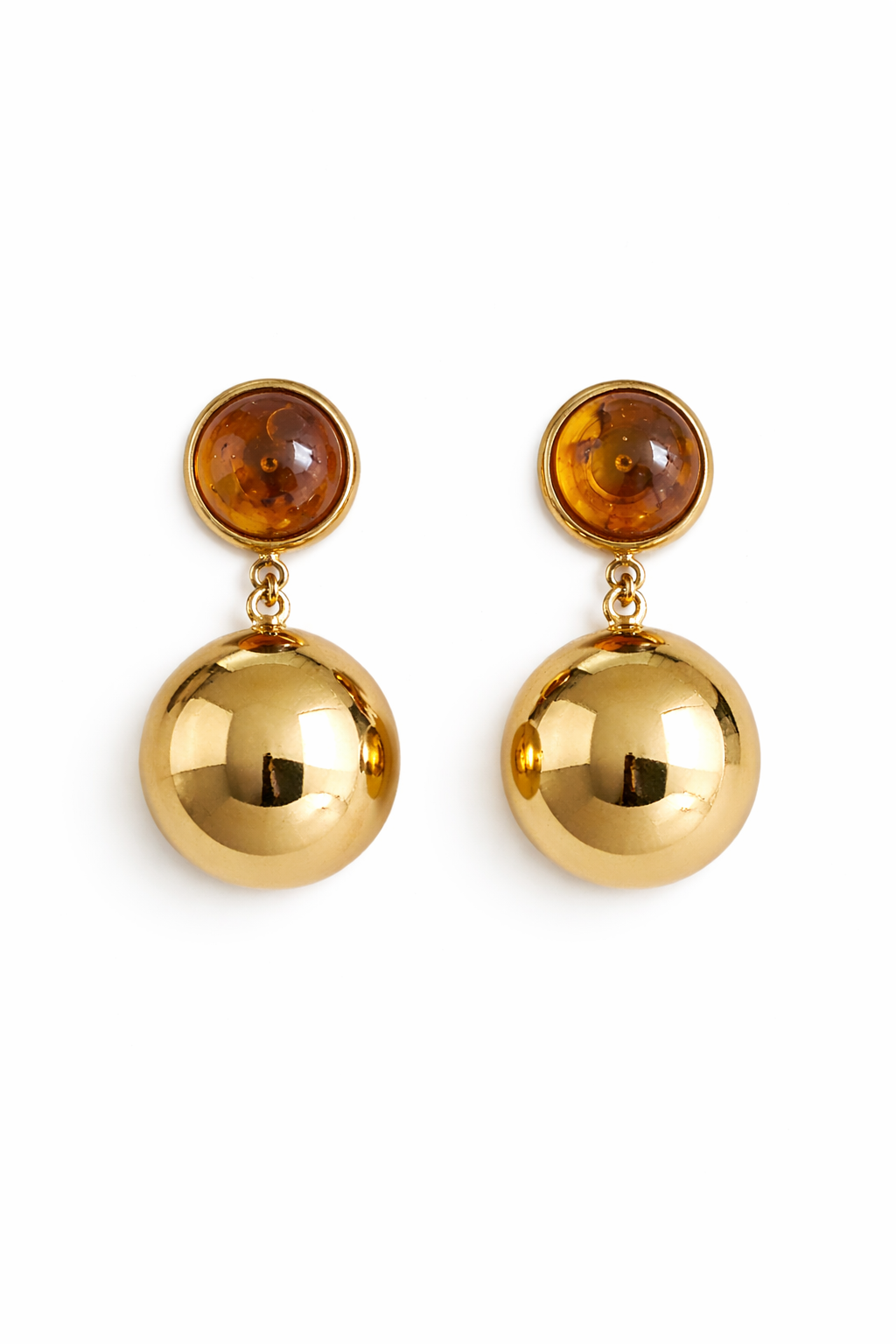 Gold earrings with amber-colored stones on a white background