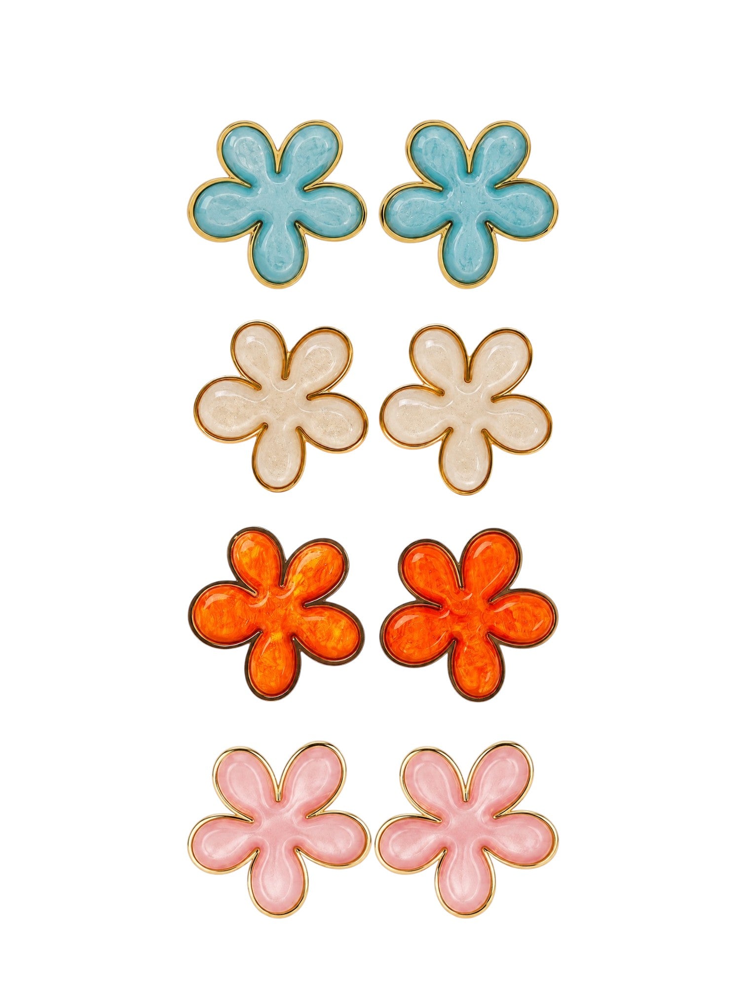 Set of colorful flower-shaped earrings on a white background