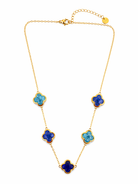 Gold necklace with blue flower-shaped pendants on a white background