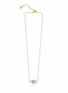 Gold necklace with a zircon evil-eye pendant on a white background