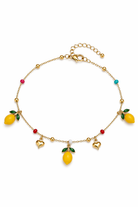 Gold stainless steel anklet with lemon charms on a white background, so cute by dimi