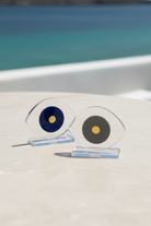 Small evil eye plexiglass decor set with gold detail in Mykonos style background – So Cute by Dimi