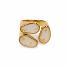 Gold ring with stone inlays on a white background