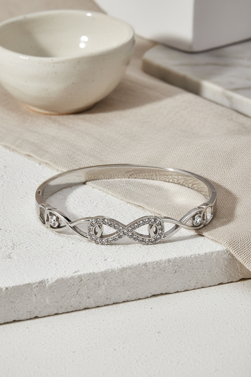 Ατσάλινο βραχιόλι Line Infinity Bracelet σε ασημί  με σύμβολο infinity και πέτρες, σε μινιμαλ neutral φόντο, So Cute by Dimi
