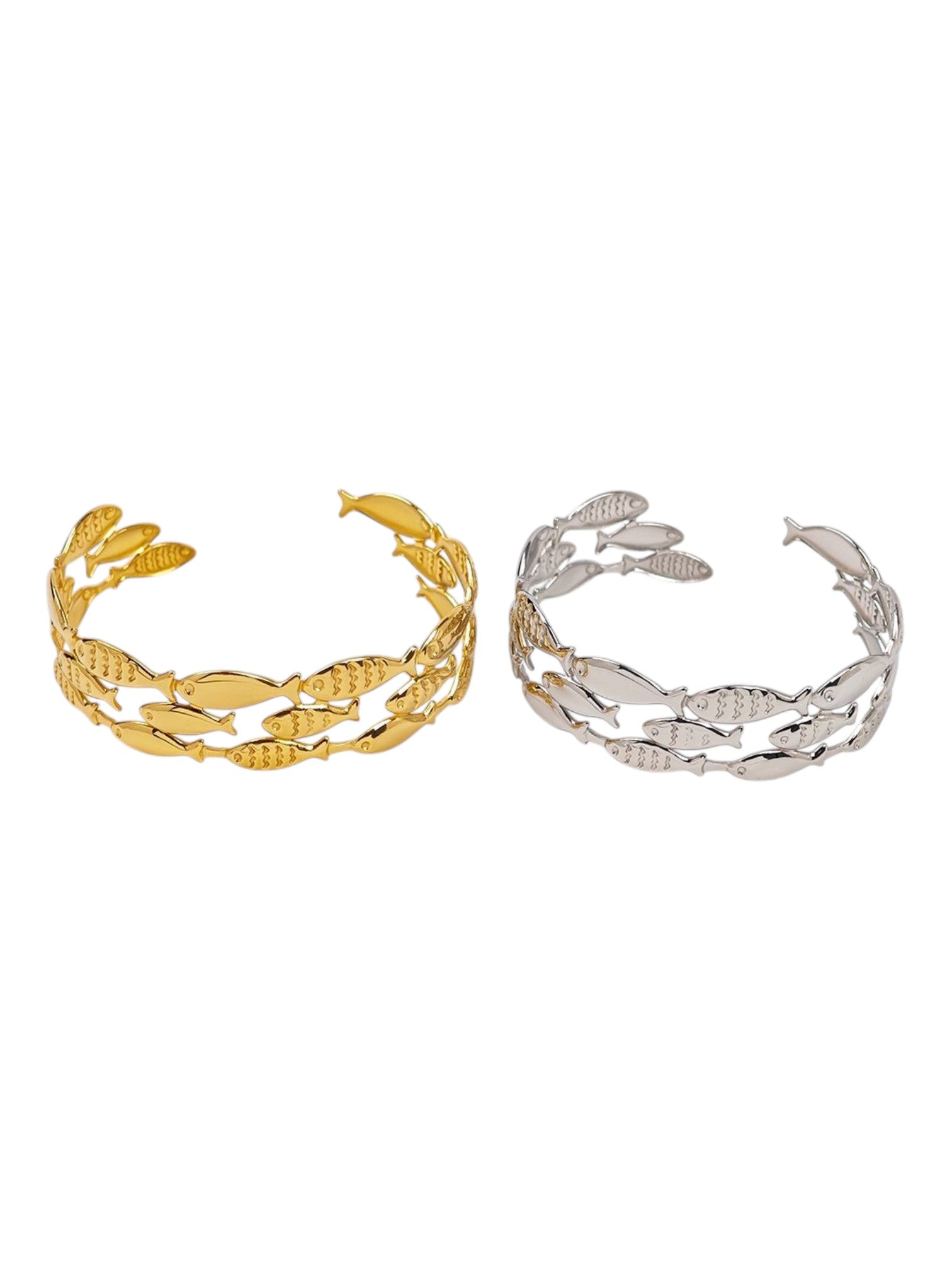 Gold and silver leaf-patterned cuffs on a white background