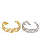 Gold and silver leaf-patterned cuffs on a white background