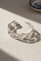 Silverstainless steel bracelet with fish designs on a summer background, So Cute by Dimi