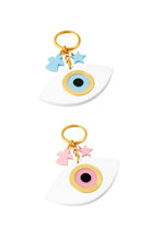 Two keychains with eye designs and colorful charms on a white background