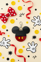 Mickey Mouse themed keychain on a colorful background with bows, buttons, and stars.