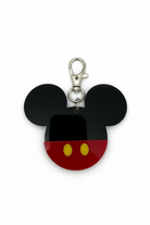 Mickey Mouse head keychain with black ears, red face, and yellow buttons on a white background