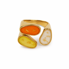Gold ring with three colorful oval stones on a white background