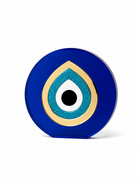 Paros Eye round tabletop evil eye decor in cobalt blue plexiglass and gold mirror acrylic on white background by So Cute by Dimi