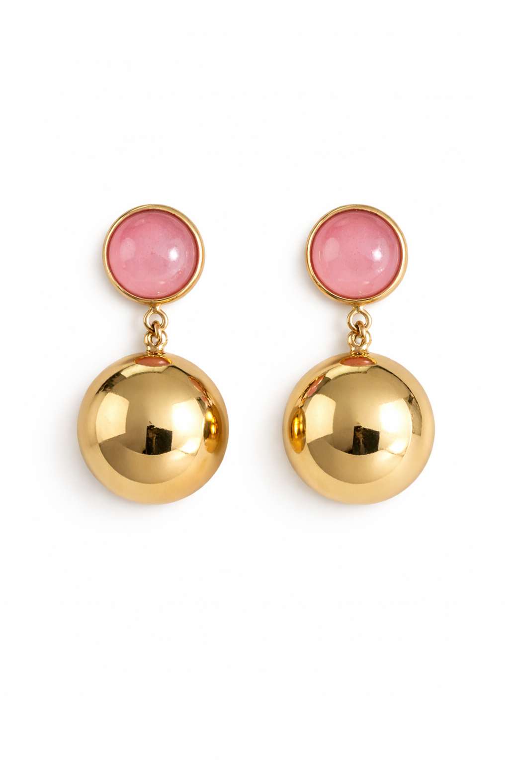 Gold earrings with pink gemstones on a white background