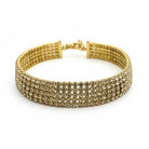 Radiant Rows bracelet ατσάλινο βραχιόλι tennis χρυσό με πολλαπλές σειρές ζιργκόν σε λευκό φόντο, So Cute by Dimi