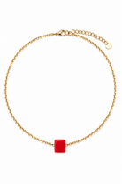 Gold stainless steel chain necklace with a red square pendant on a white background