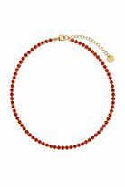 red zircon riviera necklace gold base white background