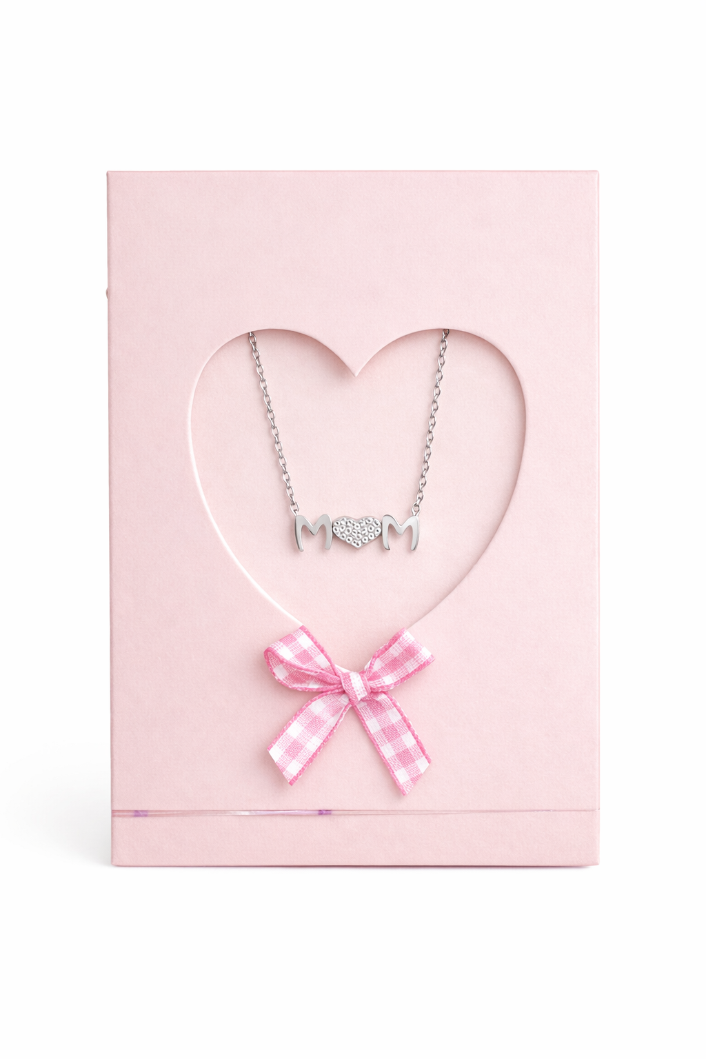 Necklace with 'MOM' pendant and pink bow in a heart-shaped pink box on a white background