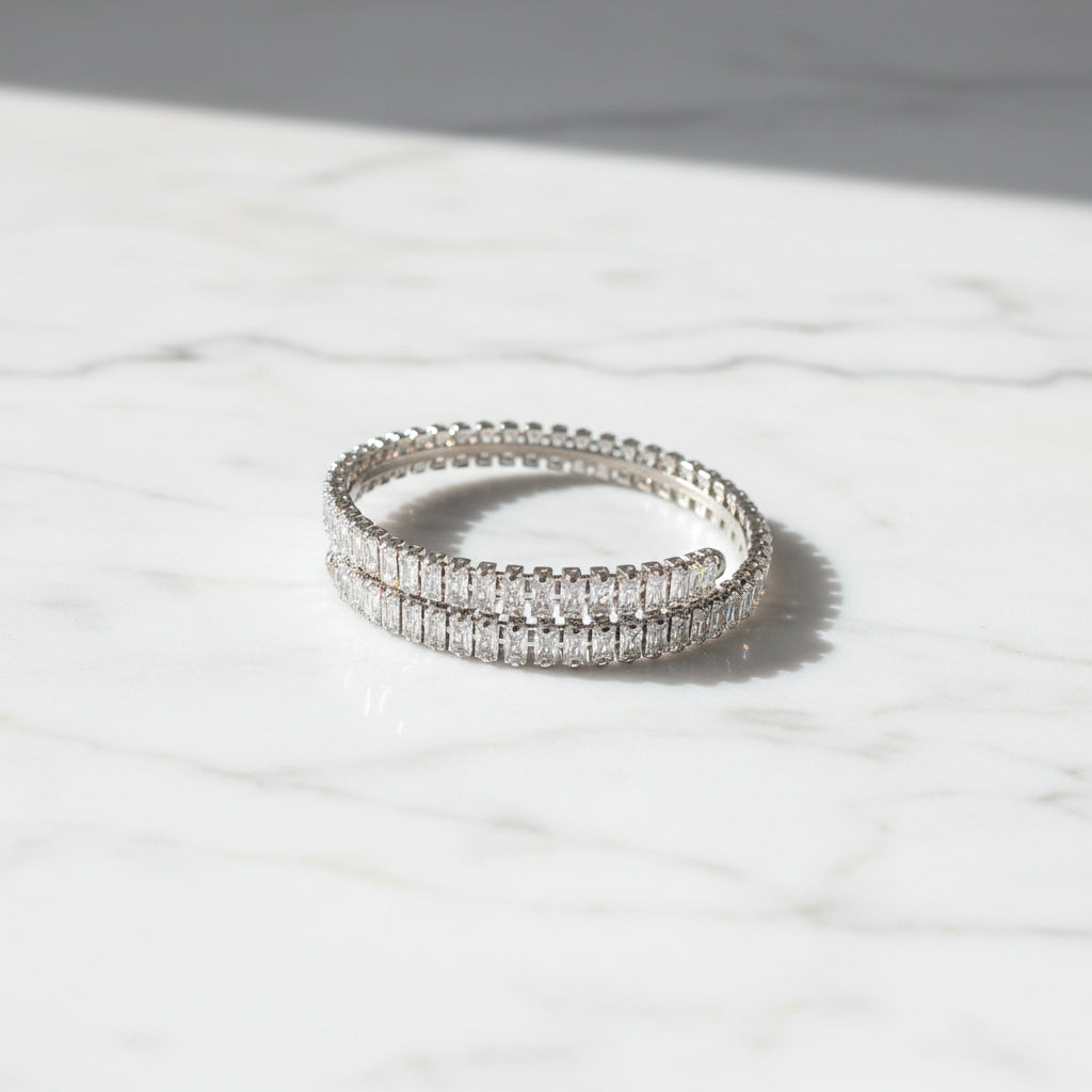 Wrapa cuff bracelet ατσάλινο ασημί open βραχιόλι με ζιργκόν σε marble επιφάνεια So Cute by Dimi.