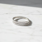 Wrapa cuff bracelet ατσάλινο ασημί open βραχιόλι με ζιργκόν σε marble επιφάνεια So Cute by Dimi.