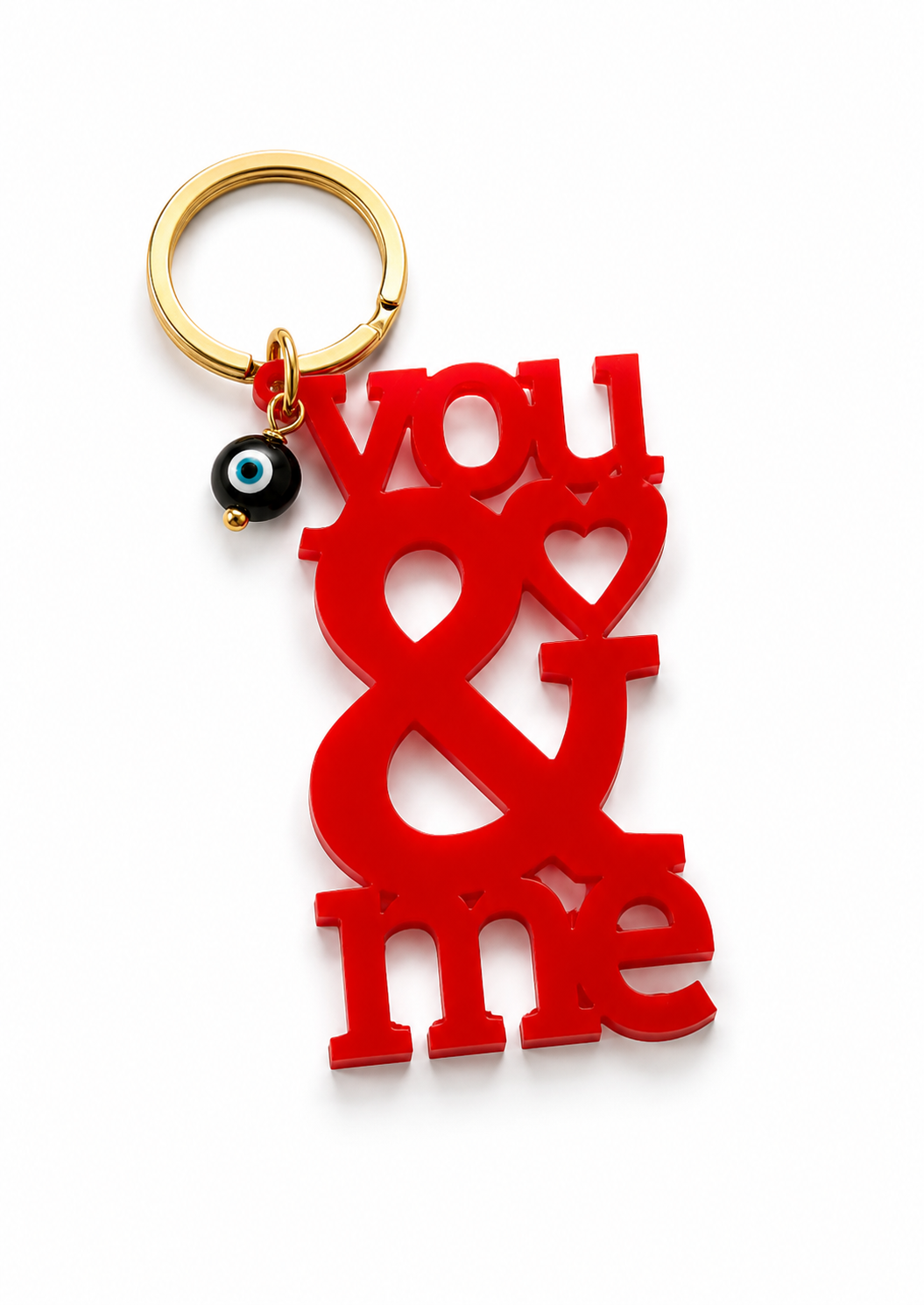 Μπρελόκ You & Me από πλεξιγκλάς με χρυσό κρίκο και διακριτικό ματάκι σε μαύρο, λευκό και κόκκινο από τη So Cute by Dimi.